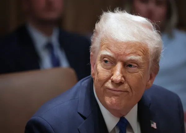 Head and shoulders photo of a seated President Donald Trump